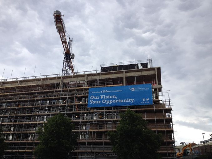 Gotta love a slogan. The extended complex under construction. No wonder those fees rocketed.